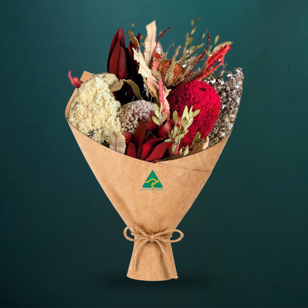 Dried Australian native bouquet in red tones featuring red banksia formosa, acorn banksia, burdett&