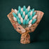 Teal and white preserved bunny tail flowers